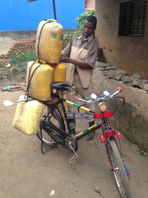 Boy gathers water in #Rwanda